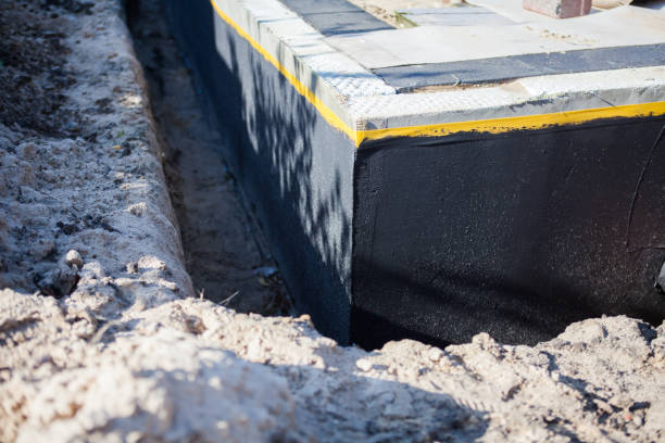 Professional Waterproofing technician working in Caldwell, OH